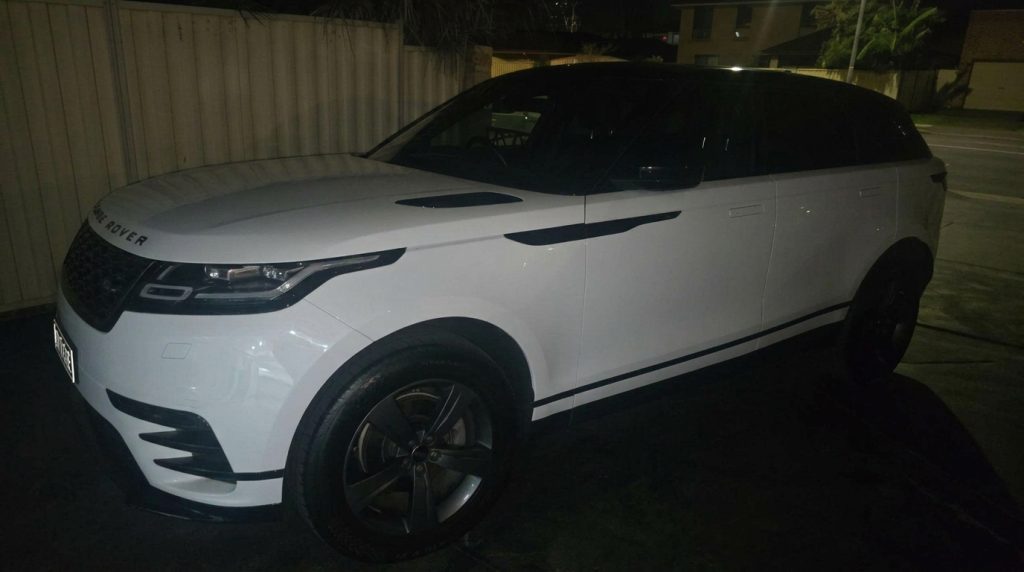 White 2018 Land Rover Range Rover Velar, front three-quarter view, available for hire in Sydney