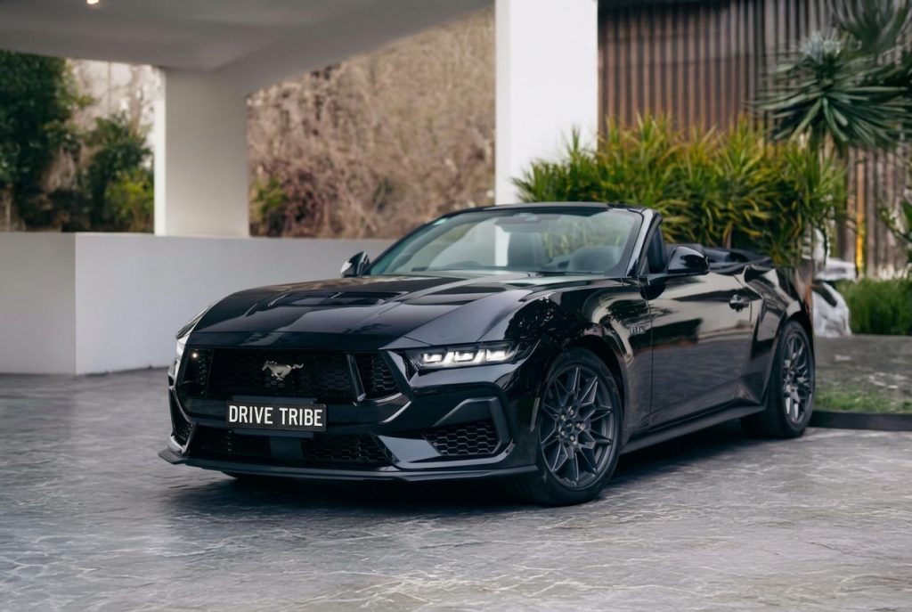 Black 2025 Ford Mustang GT, front three-quarter view, available for hire in Sydney
